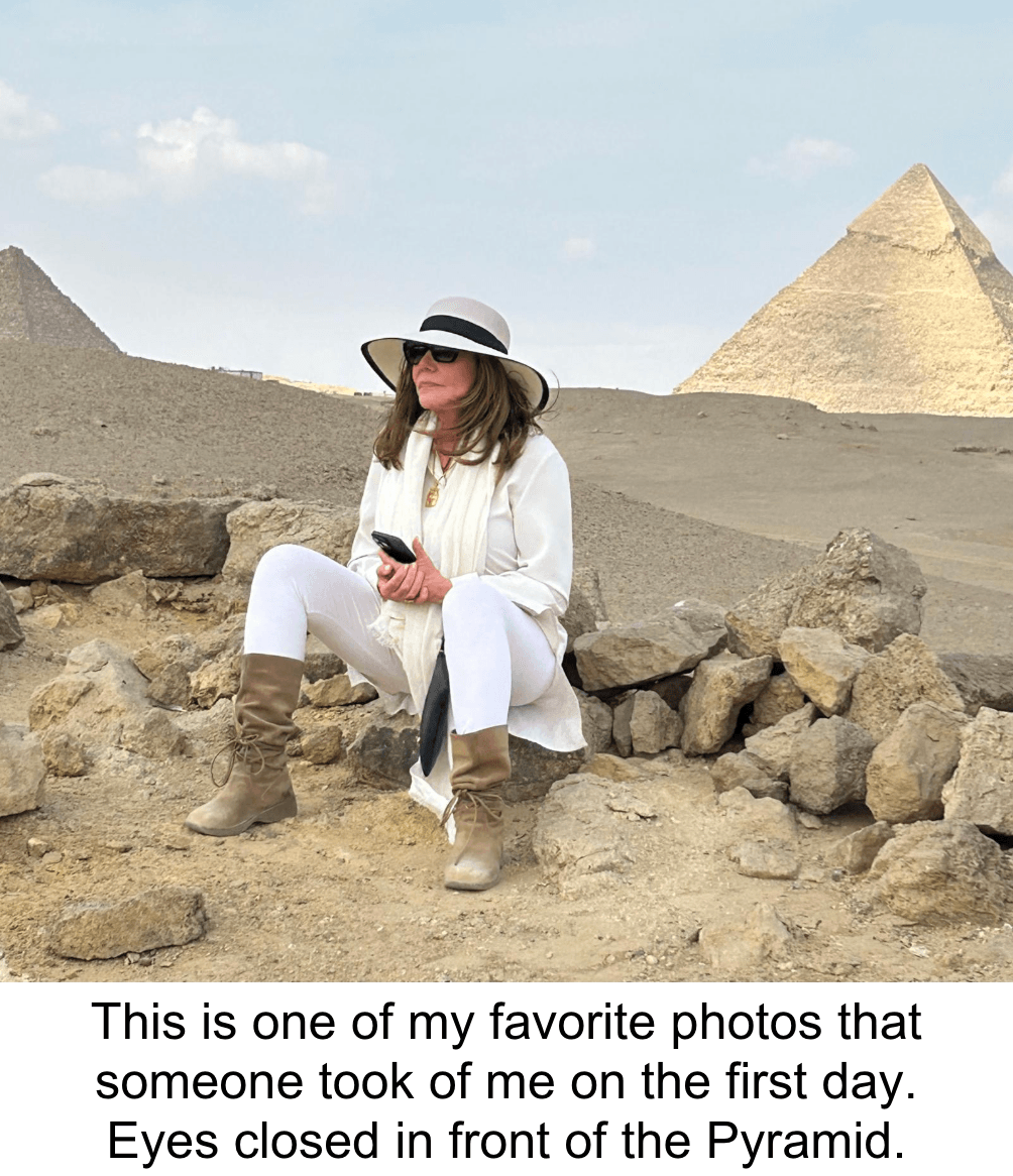 Egypt 2025 debra at solar cross w captin Debra Stangl at Solar Cross, Eyes closed in front of the Pyramid.